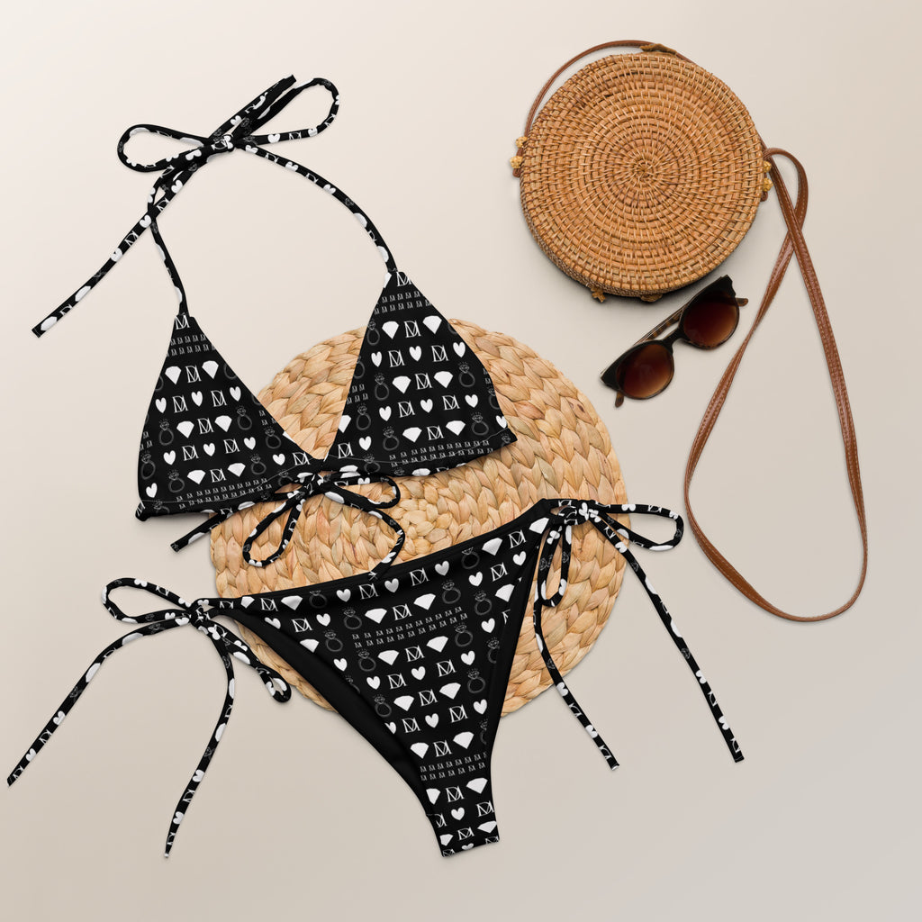 Daemon Luxury Frosted Diamonds Dolce Scusa recycled string bikini with all-over white print, front view showing intricate pattern.