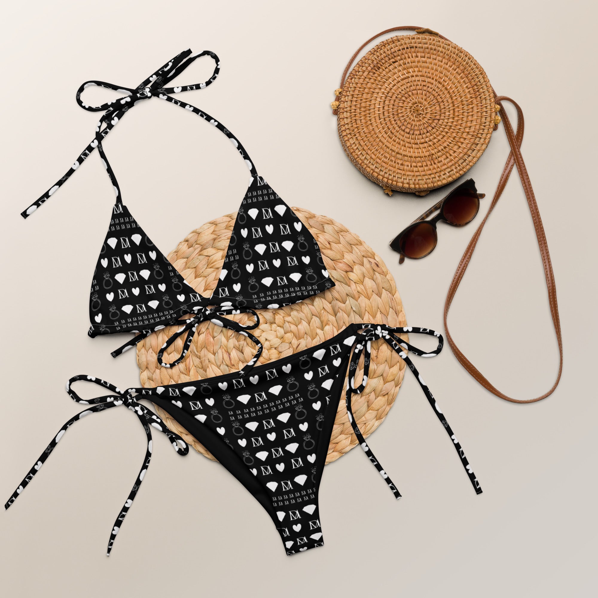 Daemon Luxury Frosted Diamonds Dolce Scusa recycled string bikini with all-over white print, front view showing intricate pattern.