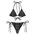 Daemon Luxury Frosted Diamonds Dolce Scusa recycled string bikini with all-over white print, front view showing vibrant pattern and fit.