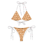 Daemon Luxury Florette Rebirth Sienna Dulce Scusa recycled string bikini with all-over white print, front view.