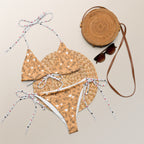 Daemon Luxury Florette Rebirth Sienna Dulce Scusa recycled string bikini with all-over white print, front view showing vibrant design.