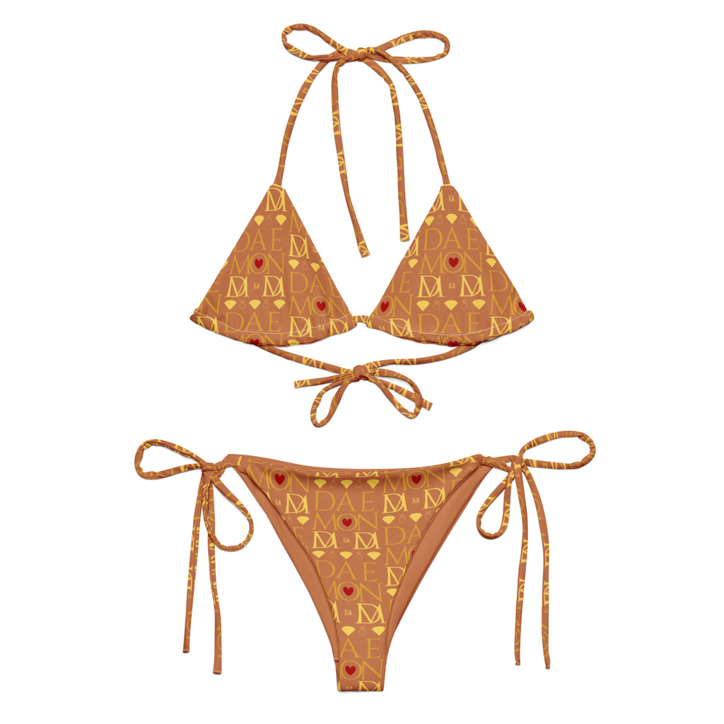 Daemon Luxury Tarmin Dim Sun Glow Dulce Scusa recycled string bikini in white with all-over print, front view.