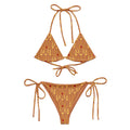 Daemon Luxury Tarmin Dim Sun Glow Dulce Scusa recycled string bikini in white with all-over print, front view.