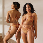 Daemon Luxury Tarmin Dim Sun Glow Dulce Scusa all-over-print recycled string bikini in white, front view showing vibrant pattern and design.
