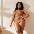 Daemon Luxury Tarmin Dim Sun Glow Dulce Scusa recycled string bikini with all-over white print, front view.