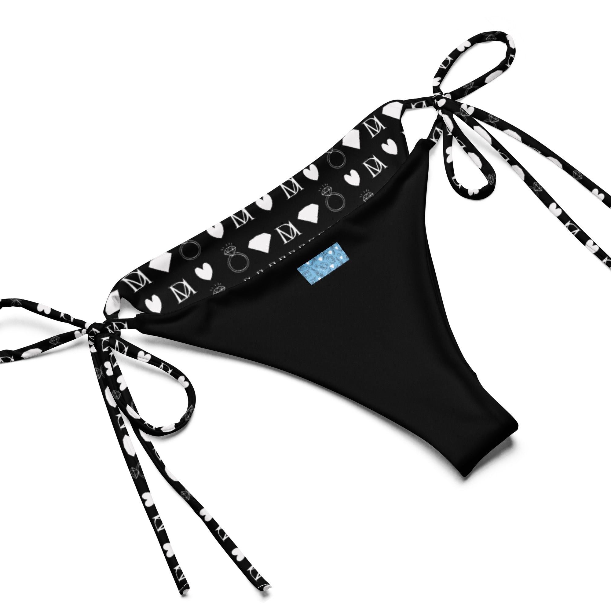 Daemon Luxury Frosted Diamonds Dolce Scusa recycled string bikini featuring all-over white print design on fabric.