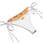 Daemon Luxury Florette Rebirth Sienna Dulce Scusa recycled string bikini with all-over white print, showcasing its vibrant design.