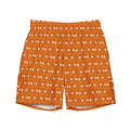 Daemon Luxury Gloomy Runner Honey all-over-print recycled swim trunks with white front design.
