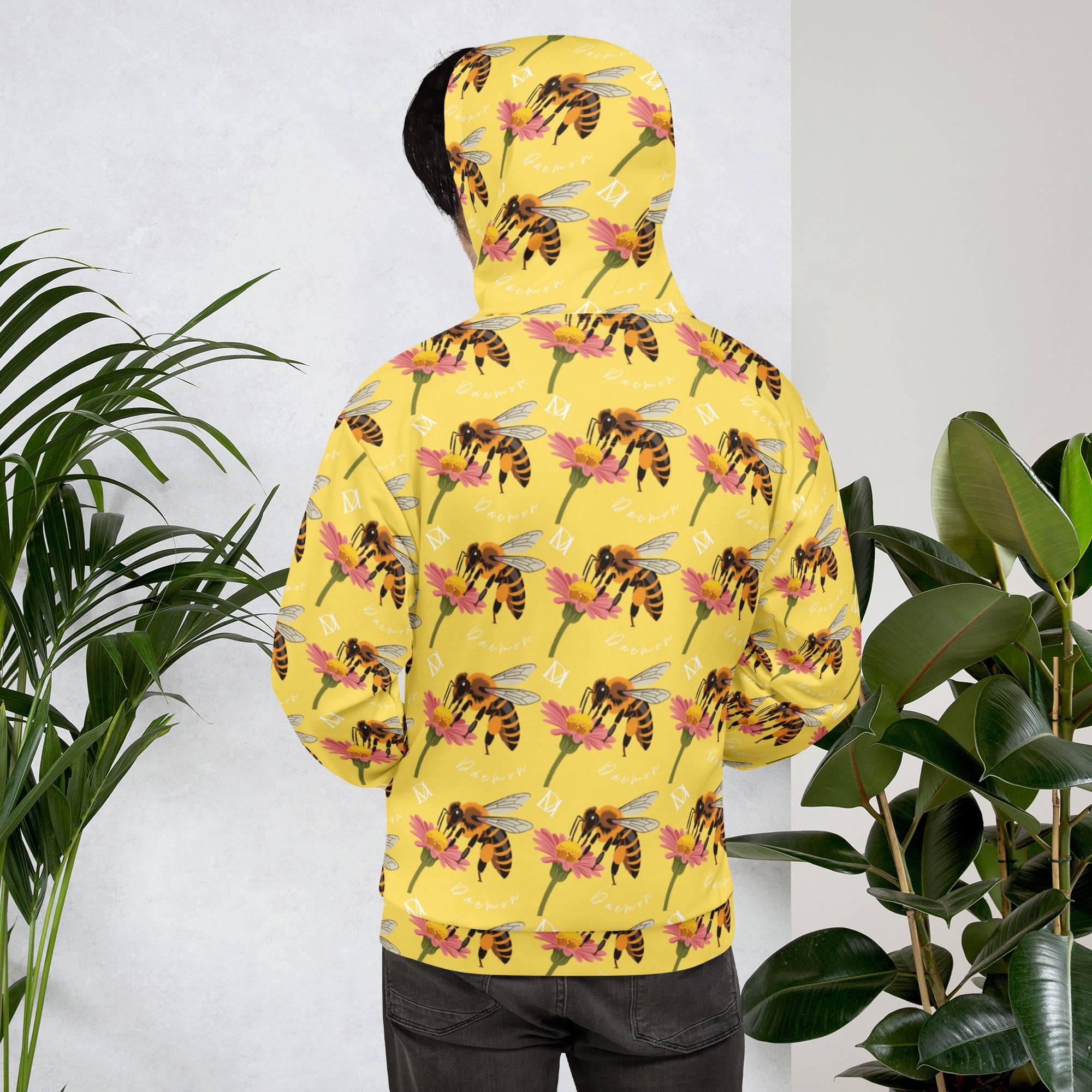 White all-over-print recycled unisex hoodie featuring Honeybee Shores (Solo Star) design by Daemon Luxury, displayed from the back.