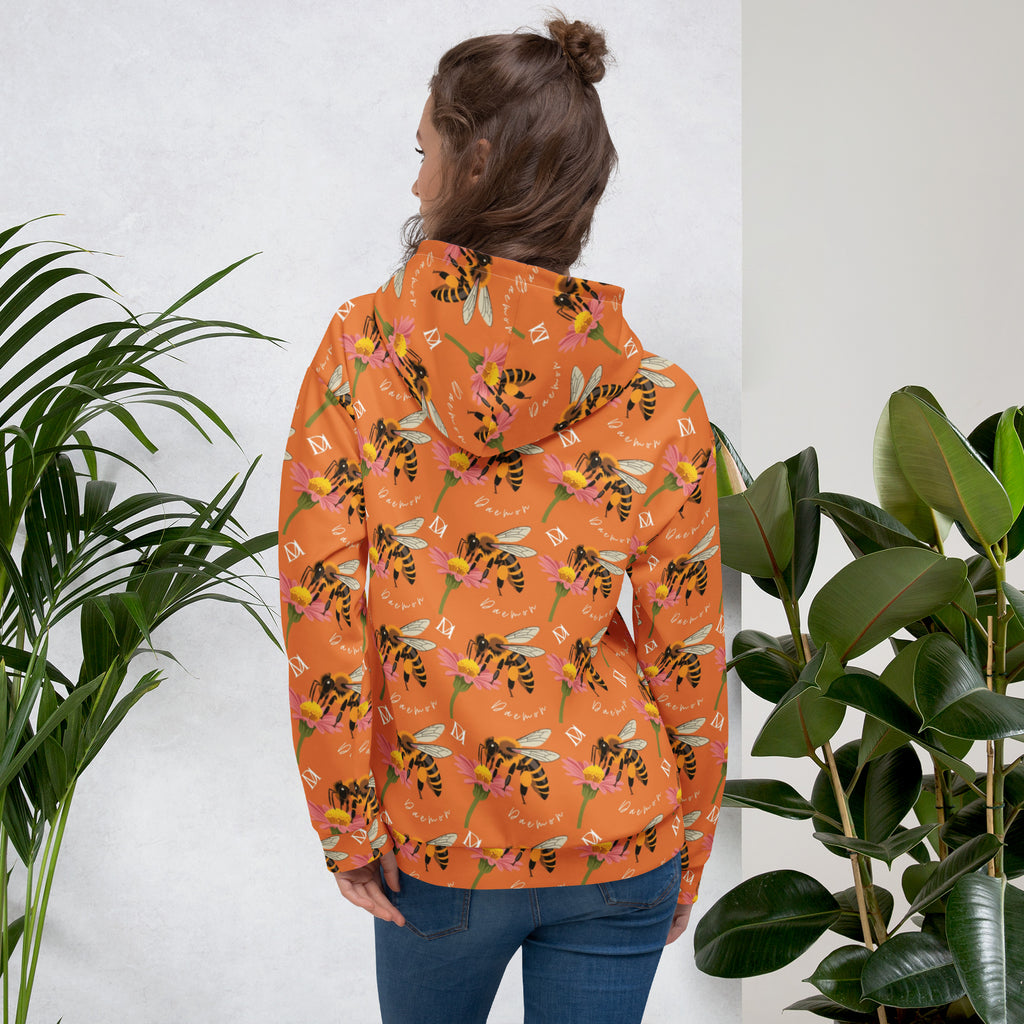 Recycled white unisex hoodie with all-over honeybee shores sunset print and Daemon Luxury branding on the back.