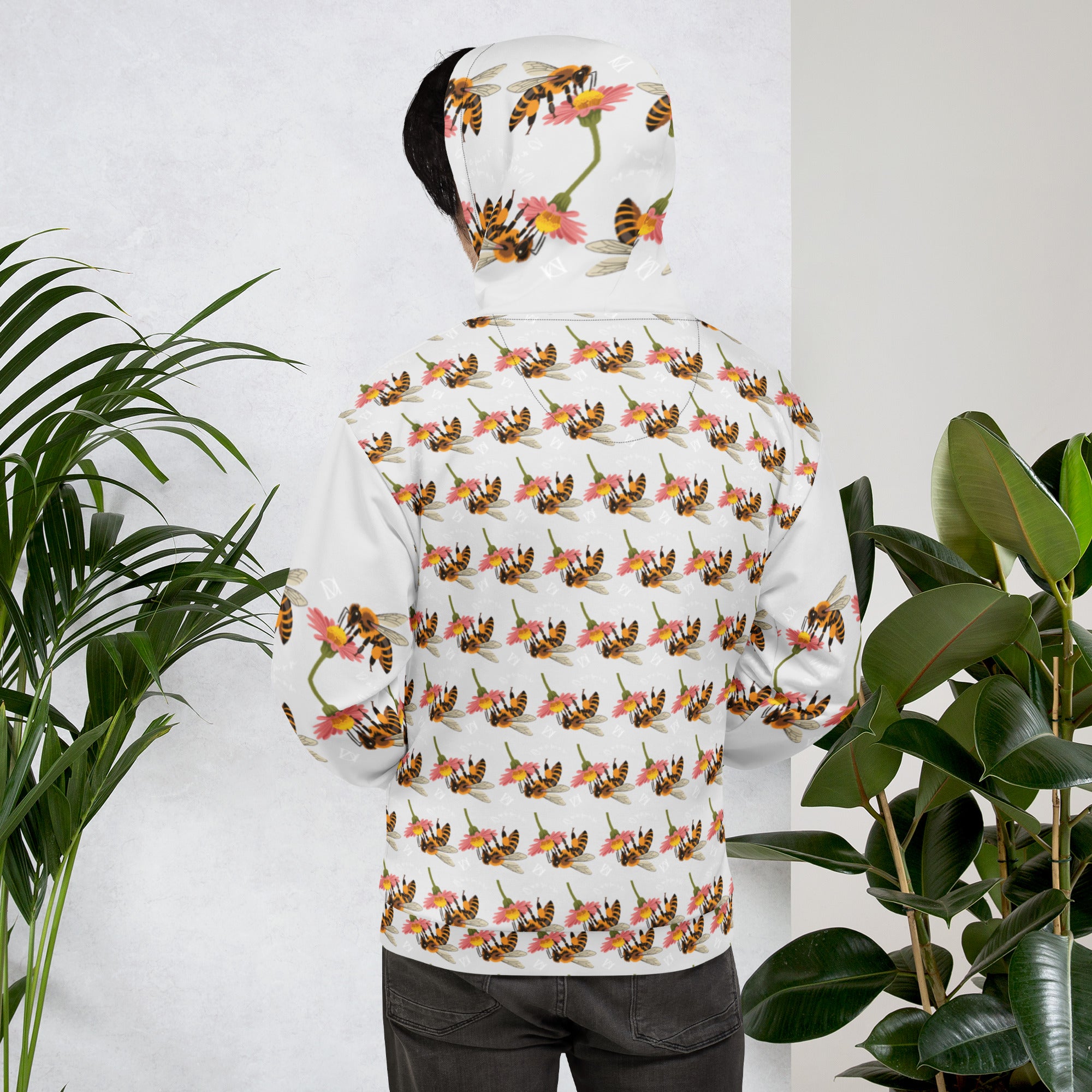 White all-over-print recycled unisex hoodie featuring Honeybee Shores Valley Coast design by Daemon Luxury, shown from the back.