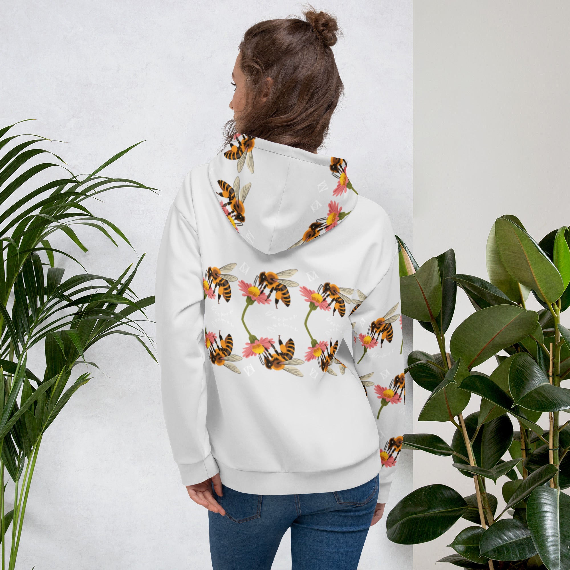 White unisex hoodie from Daemon Luxury with all-over Honeybee Shores Sun Enriched print on the back.
