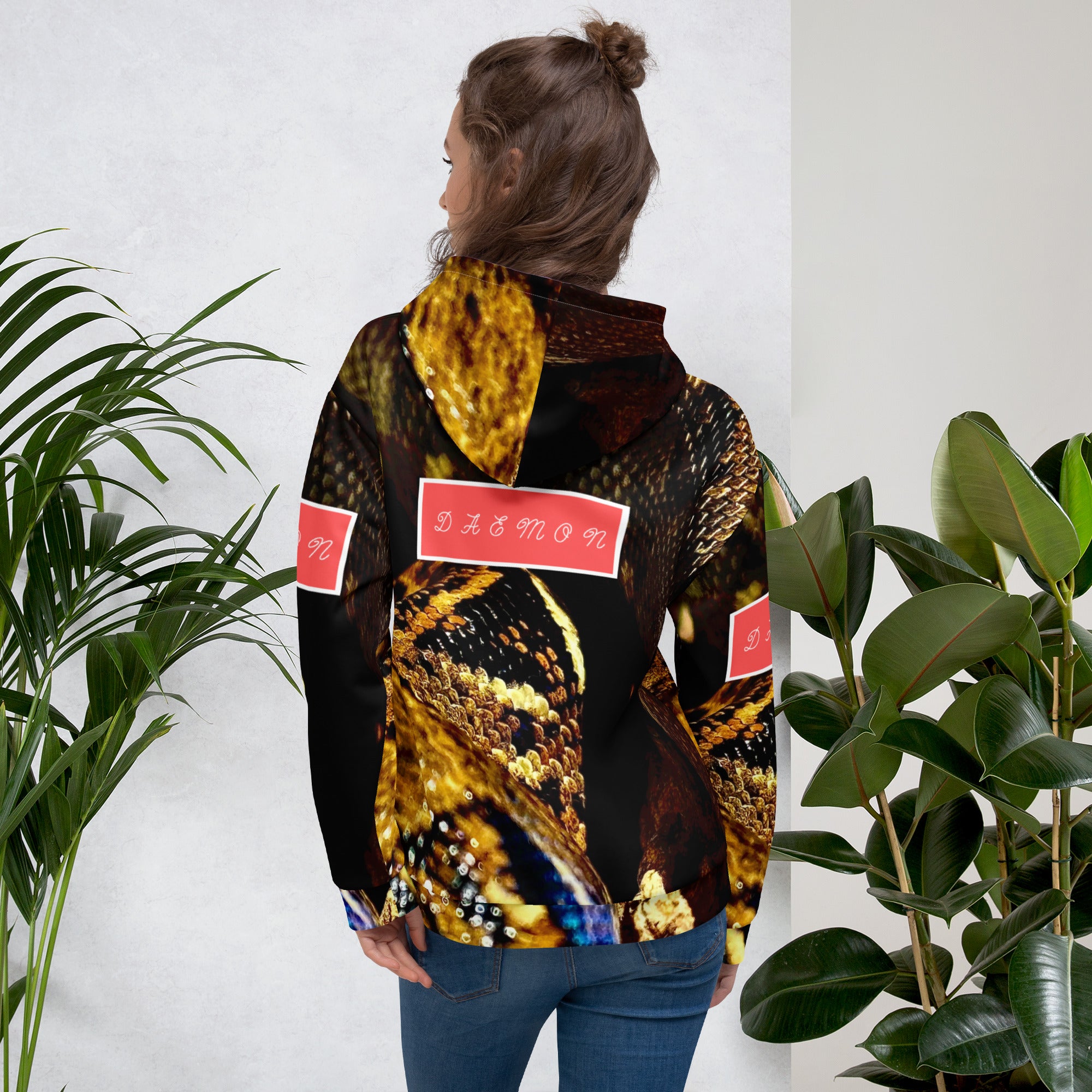 Recycled unisex white hoodie with all-over serpentine Nicaragua print by Daemon Luxury, showcasing back design.