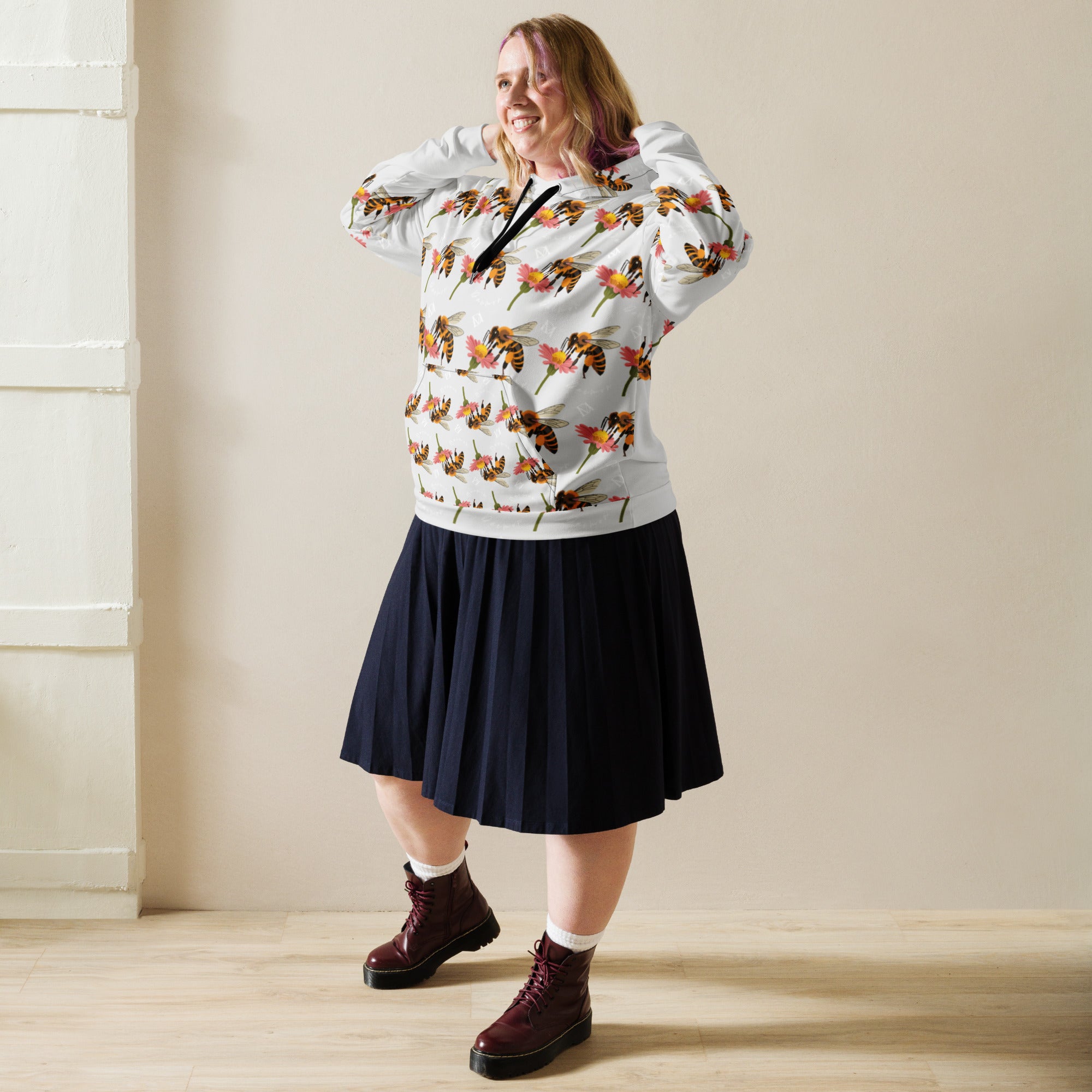Recycled unisex white hoodie with all-over honeybee shores dusk print, featuring a ribbed design and Daemon Luxury branding.