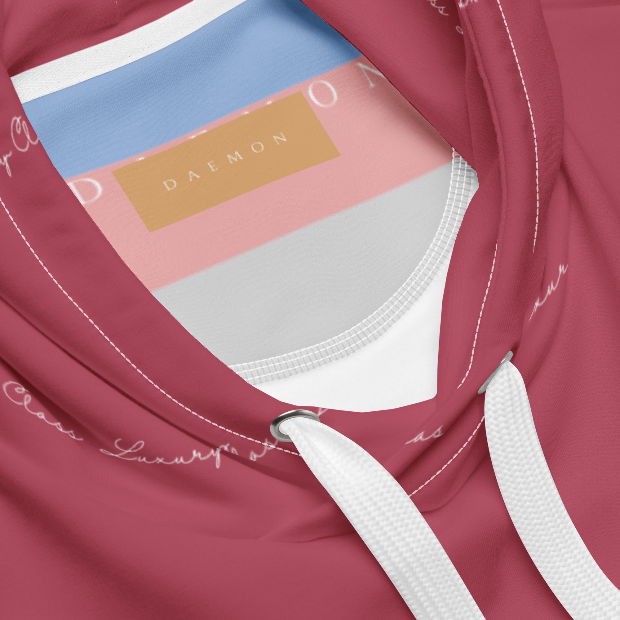 White recycled hoodie with all-over Rich Ruby Stones print by Daemon, featuring a hood and casual unisex design.
