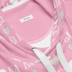 Unisex white hoodie with all-over frosted diamond and cotton candy cinzel print by Daemon, featuring a front pocket and drawstring hood.
