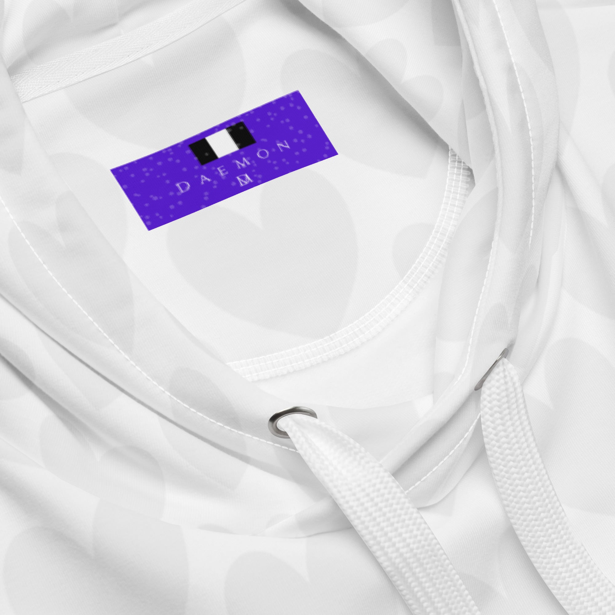 White Heartfelt Artica unisex hoodie by Daemon Luxury featuring all-over recycled print and a cozy hood.