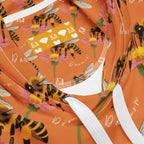 Unisex white hoodie with Honeybee Shores Golden Hour all-over print by Daemon Luxury, featuring vibrant, nature-inspired design.