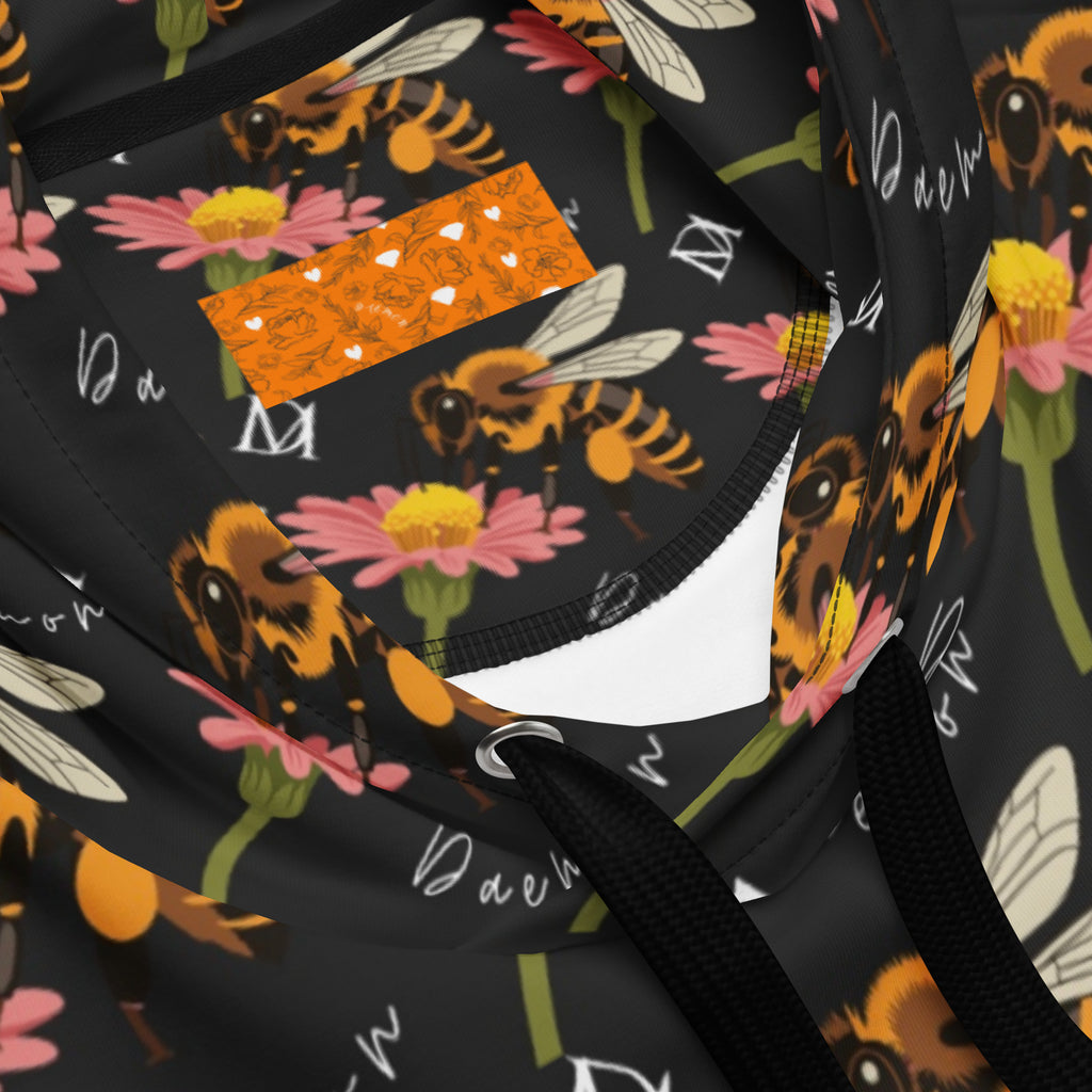 Unisex white hoodie with all-over honeybee shores print by Daemon Luxury, featuring a cozy hood and recycled fabric design.