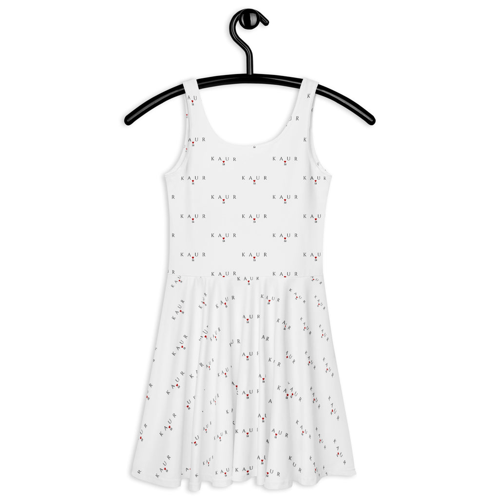 White all-over-print skater dress featuring speckled diamond Artica design by Daemon Luxury, shown from the back.
