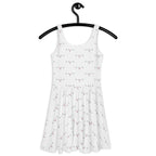 White all-over-print skater dress featuring speckled diamond Artica design by Daemon Luxury, shown from the back.
