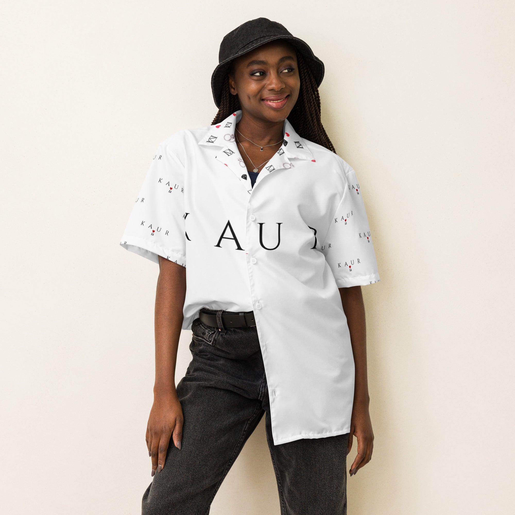 White unisex button shirt by Daemon Luxury with all-over print, featuring a classic collar and front buttons.