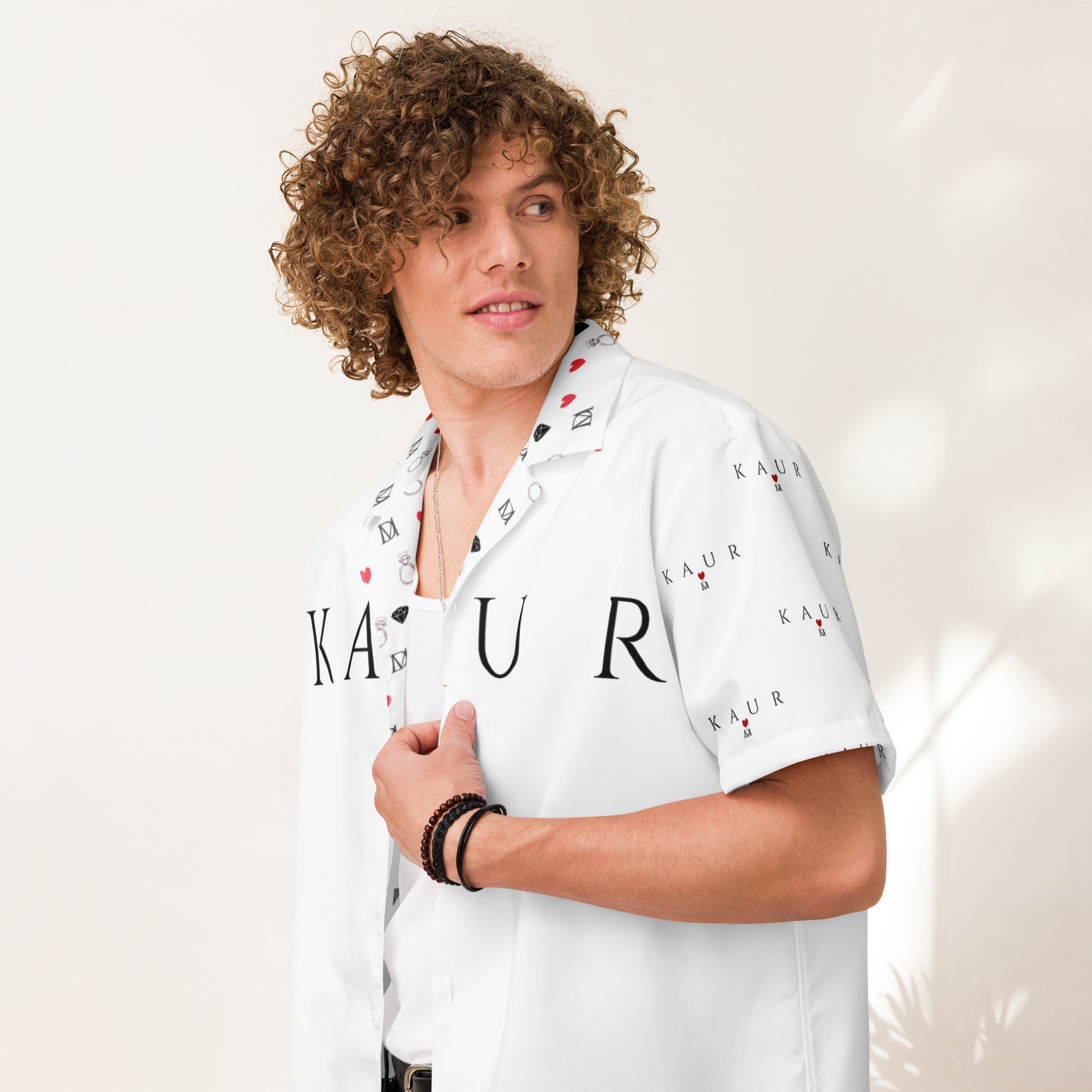 All-over print unisex button shirt by Daemon Luxury, showcased in white with a stylish pattern on the front.