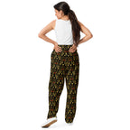 Unisex wide-leg joggers with all-over Sun Glow California print by Daemon Luxury, white background, relaxed fit.