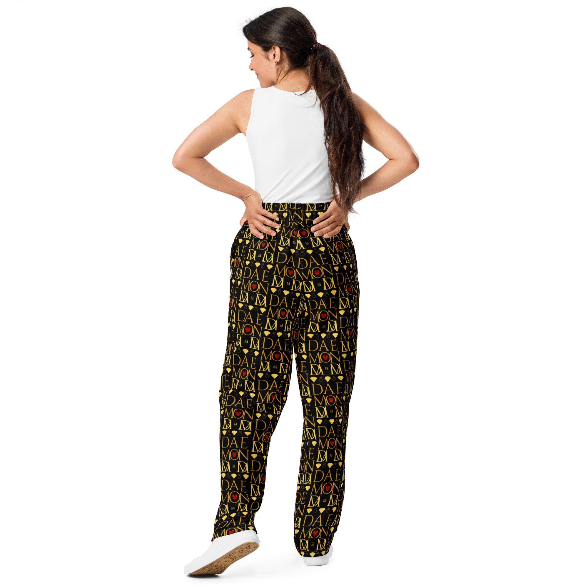 Unisex wide-leg joggers with all-over Sun Glow California print by Daemon Luxury, white background, relaxed fit.