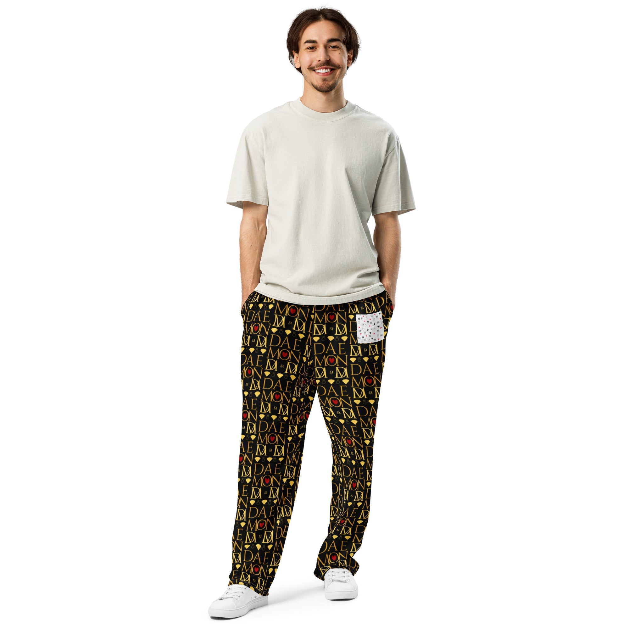 Unisex wide-leg joggers with Sun Glow California all-over print from Daemon Luxury, white front view.