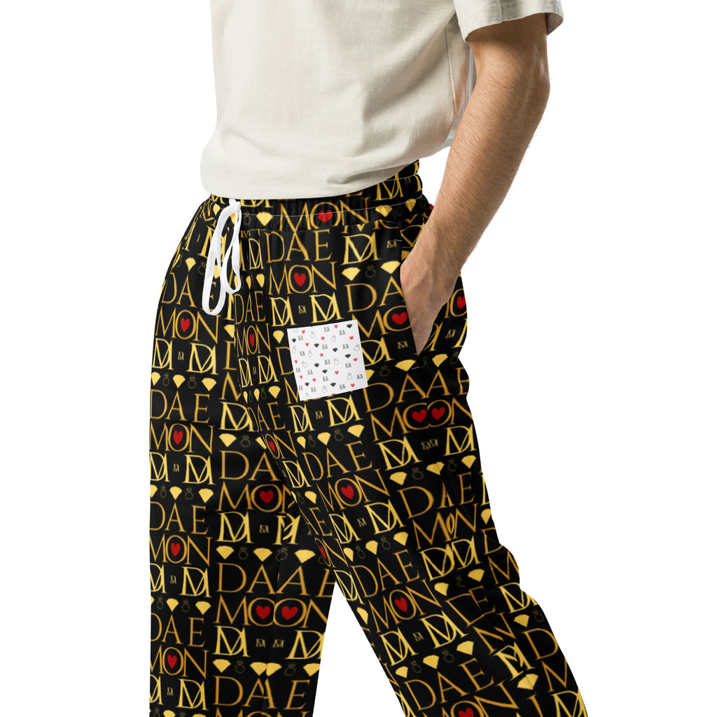 All-over print white unisex wide-leg joggers featuring Sun Glow California and Daemon Luxury branding.