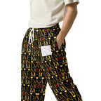 All-over print white unisex wide-leg joggers featuring Sun Glow California and Daemon Luxury branding.