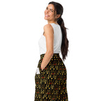 Unisex white wide-leg joggers with Sun Glow California all-over print from Daemon Luxury, shown from the back left side.
