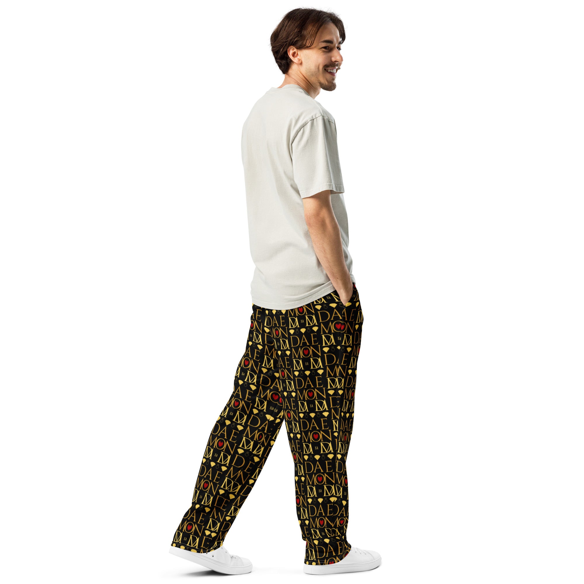 Unisex wide-leg joggers with all-over Sun Glow California print by Daemon Luxury, shown from the right back in white fabric.