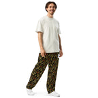 Daemon Luxury Sun Glow California all-over-print unisex wide-leg joggers in white, shown from the right front angle.