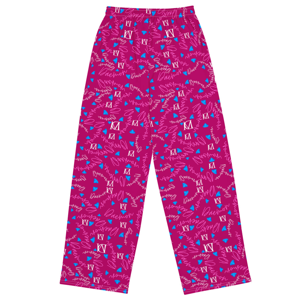 Unisex wide-leg pants with all-over magenta Picasso mirror print by Daemon Luxury, shown from the back.