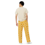 Daemon Luxury Tarmin Honeybees unisex wide-leg Sala pants with all-over honeybee print on white fabric.