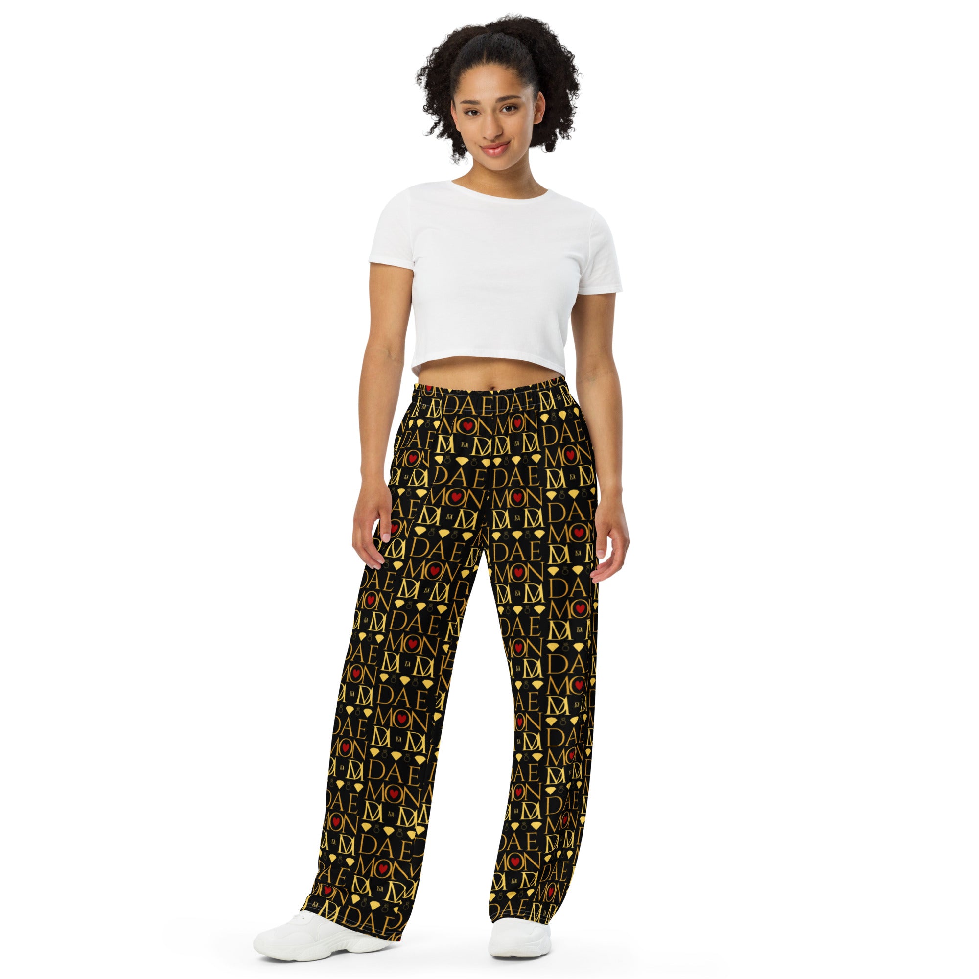 Unisex white wide-leg lounge pants with Sun Glow California all-over print by Daemon Luxury, front view.