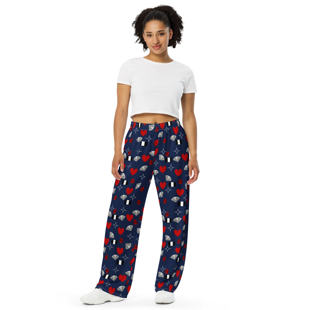 Unisex white wide-leg pants from Daemon Luxury's Foreigners Luv collection with all-over bold print design.