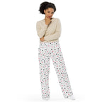 Unisex wide-leg pants by Daemon Luxury with speckled diamond art print in white, full-front view showing stylish, comfortable design.