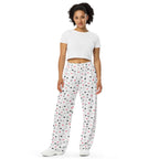Unisex wide-leg pants with speckled diamond pattern in white by Daemon Luxury, featuring an all-over-print design.
