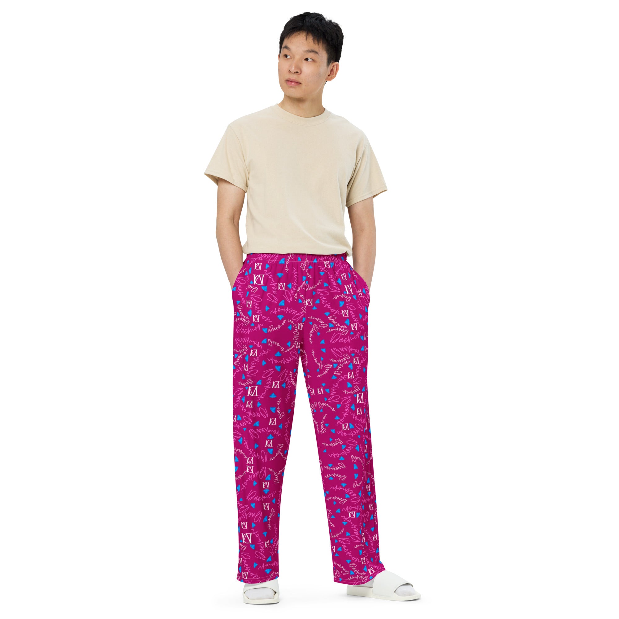 Unisex wide-leg pants by Daemon Luxury featuring all-over magenta Picasso mirror print on white fabric.