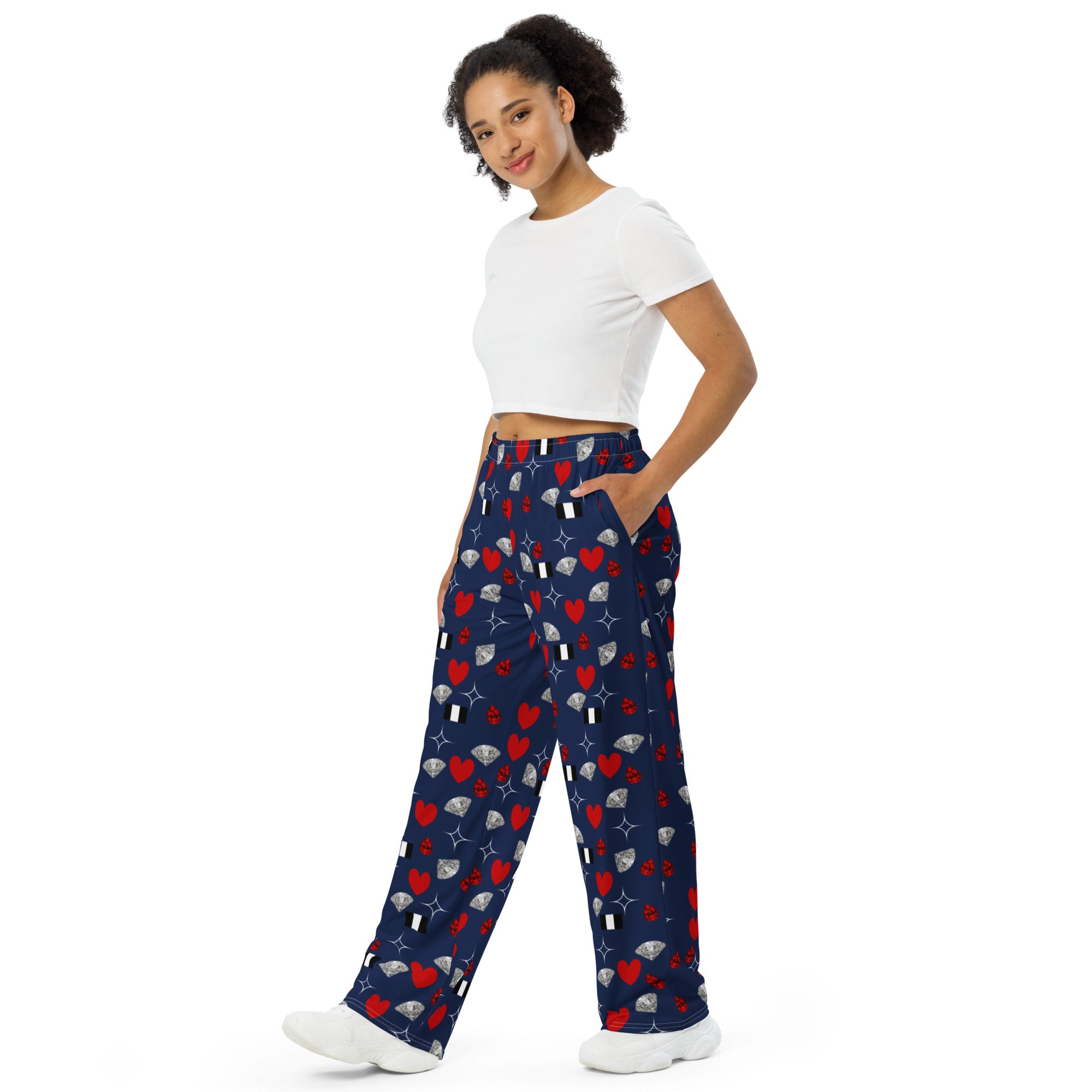 Unisex white wide-leg pants with all-over print from Daemon Luxury's Foreigners Luv Upscale Pantaloni Sala collection.