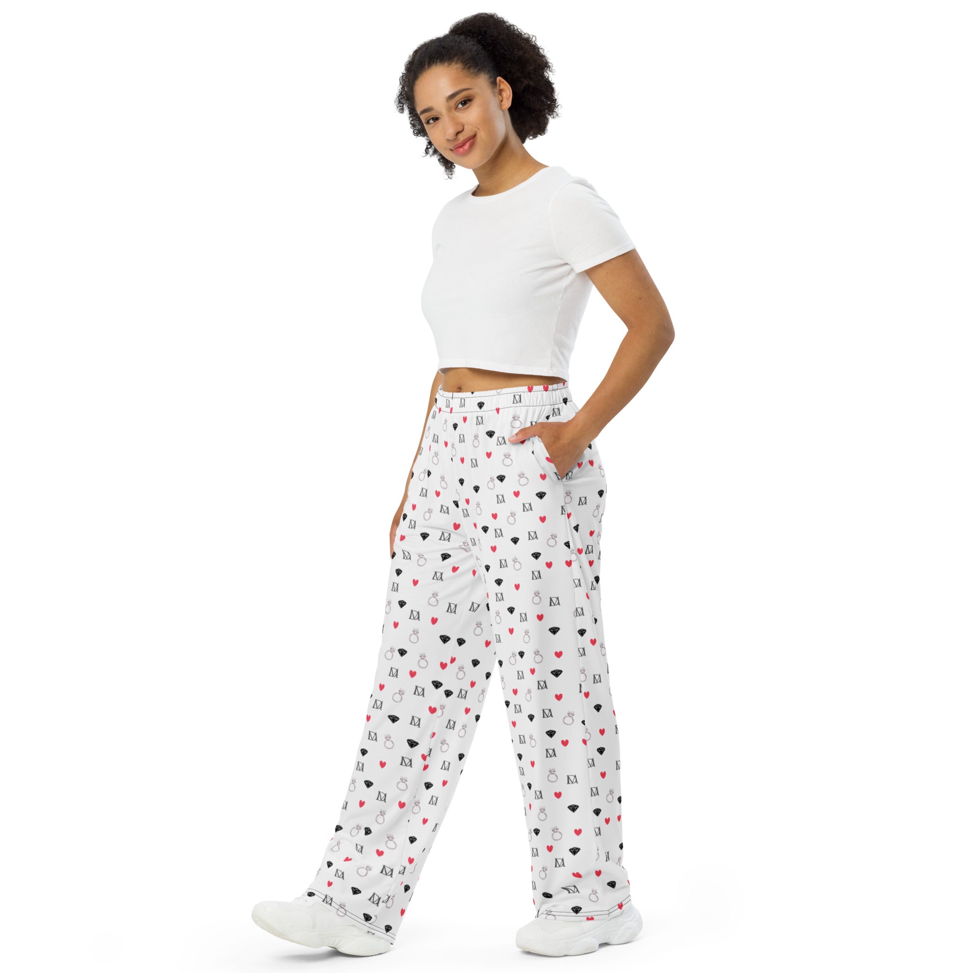 Unisex wide-leg pants with speckled diamond Artica Blizzard print by Daemon Luxury, showing front view with all-over white pattern.