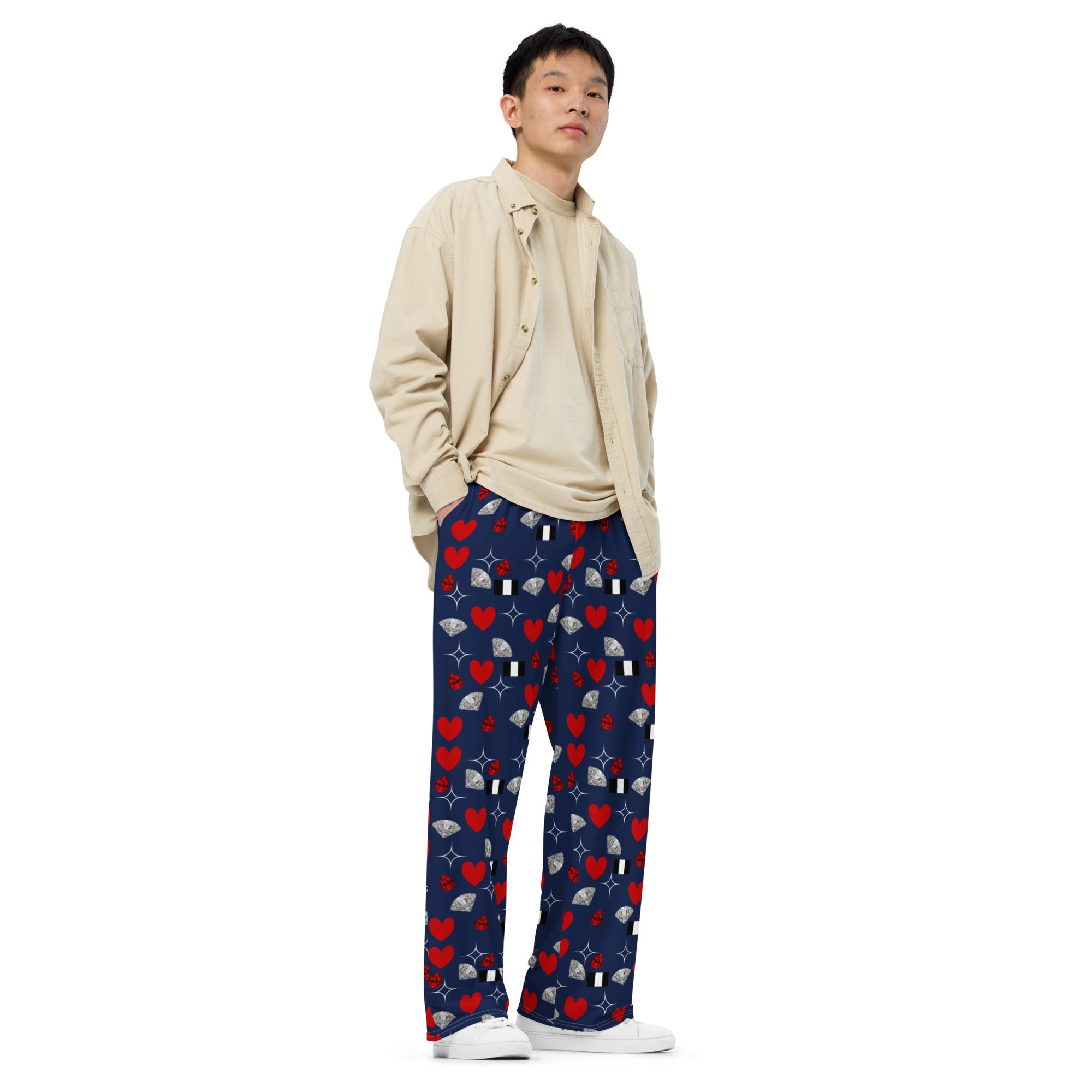 Unisex wide-leg pants by Daemon Luxury featuring all-over print design in white, shown from the front with relaxed fit.