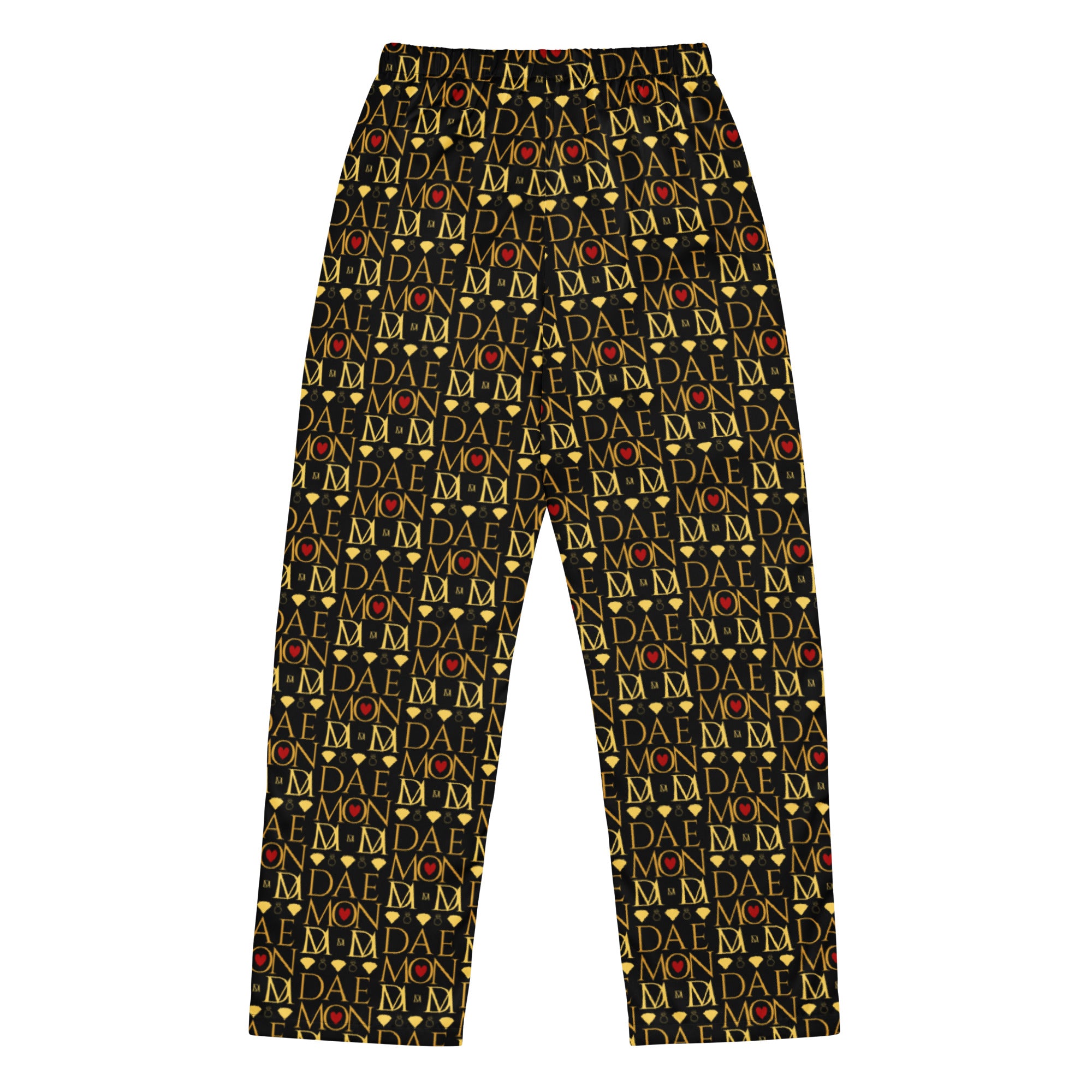 Daemon Luxury Sun Glow California women's silk pajama pants with all-over black and colorful print, back view.
