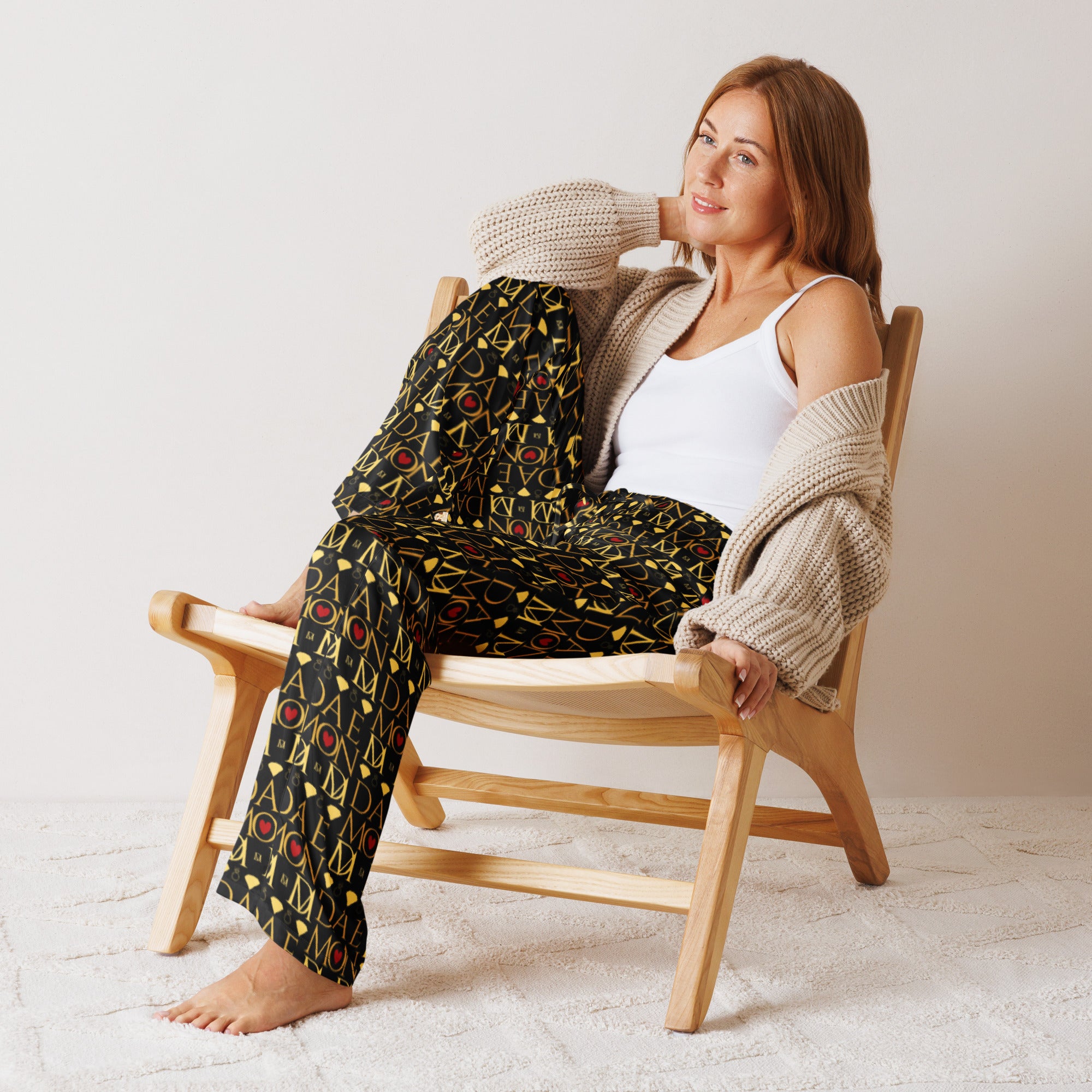 Daemon Luxury Sun Glow California women's silk pajama pants with all-over black print and comfortable front design.