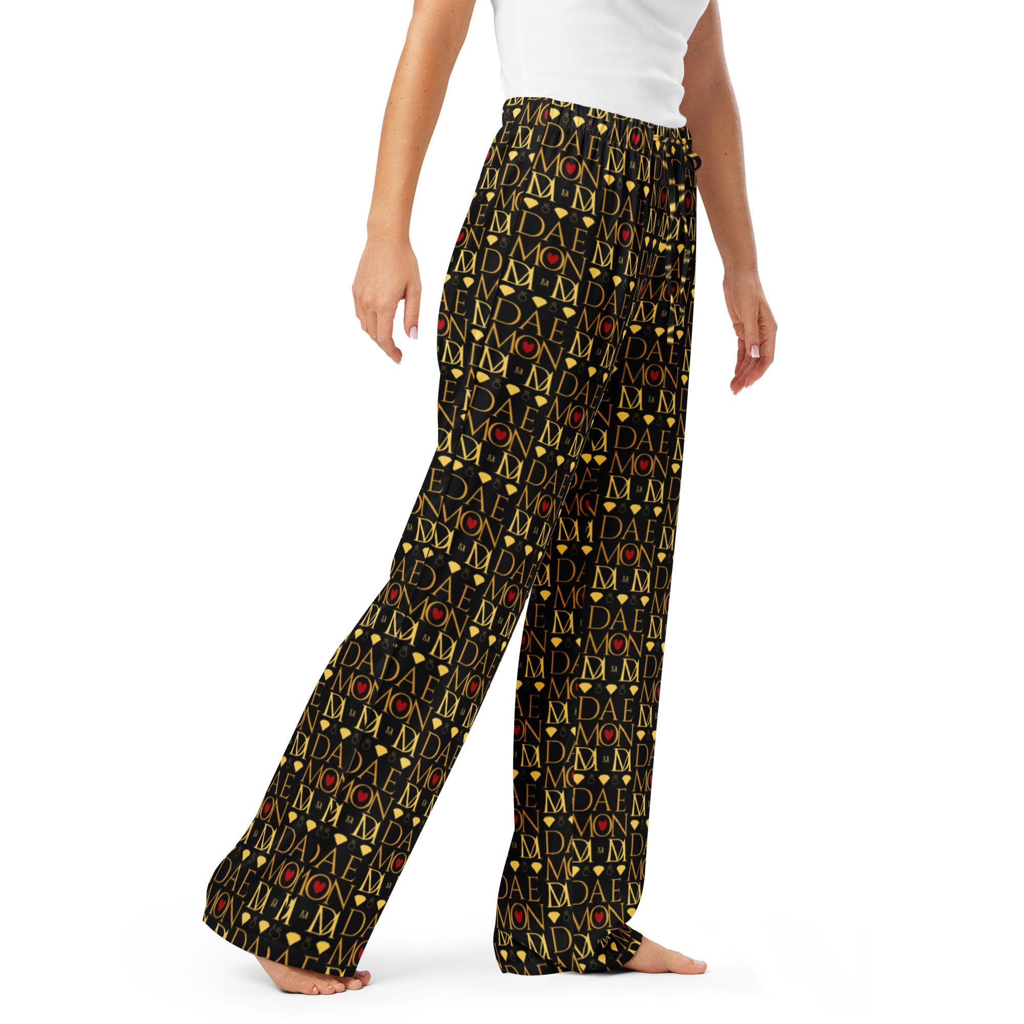 Daemon Luxury Sun Glow California women's silk pajama pants with all-over black print, shown from the front.