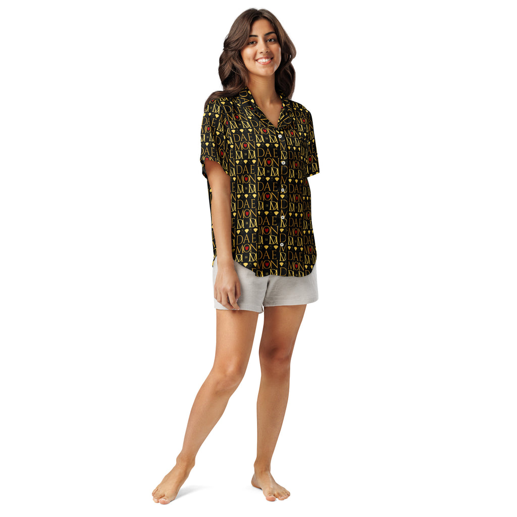 Daemon Luxury Sun Glow California women's short-sleeve silk pajama top with all-over black and colorful print.