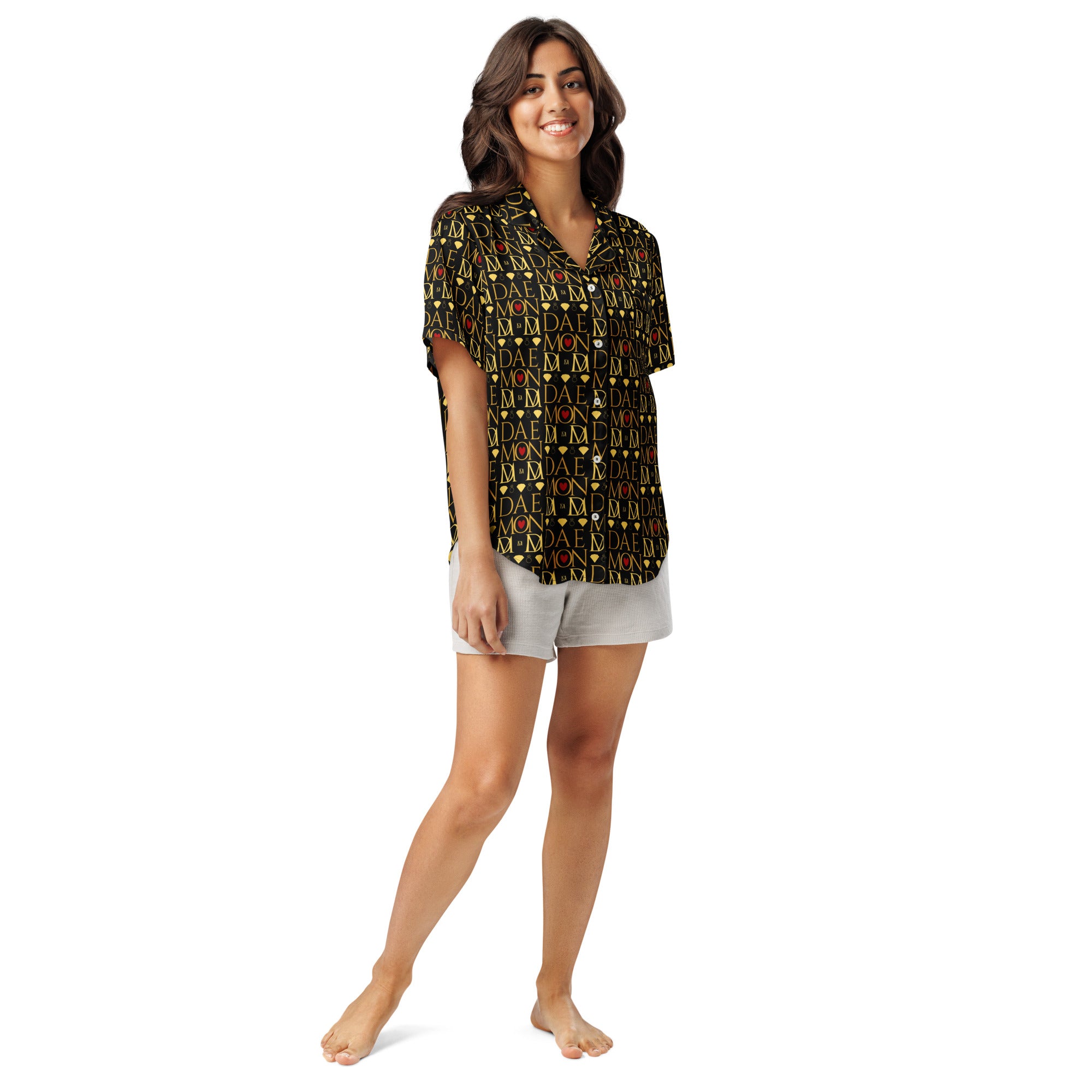 Daemon Luxury Sun Glow California women's short-sleeve silk pajama top with all-over black and colorful print.
